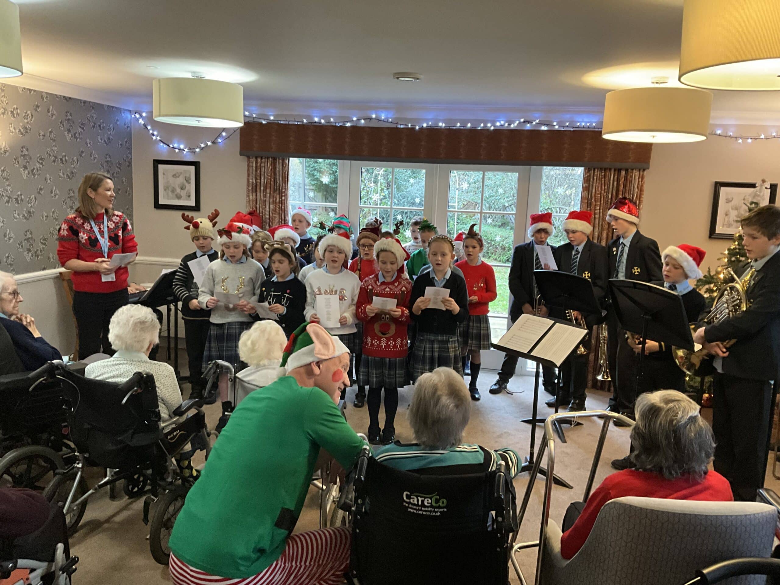 CPS pupils performing Christmas Carol singing for community