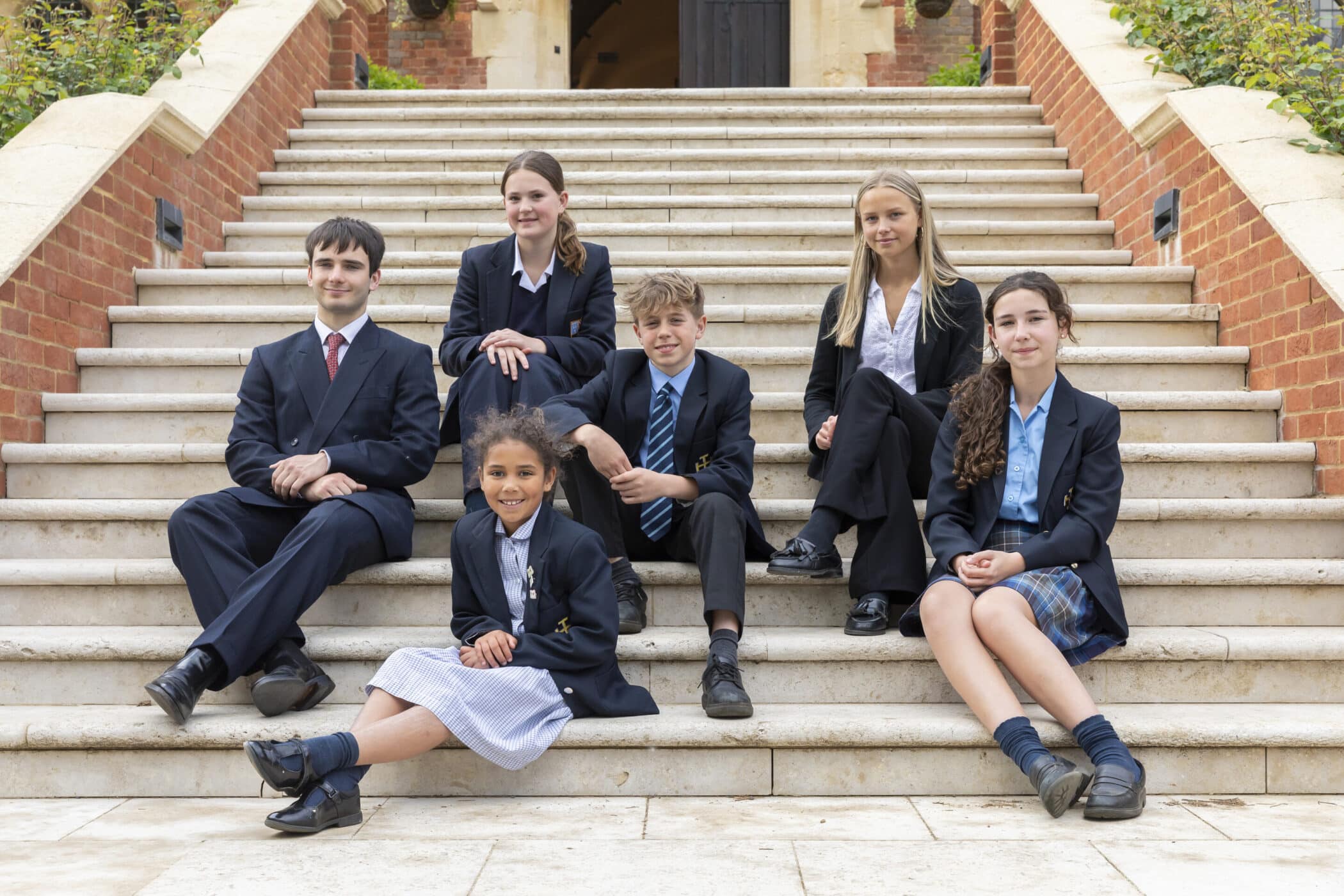 CS pupils on front steps of school