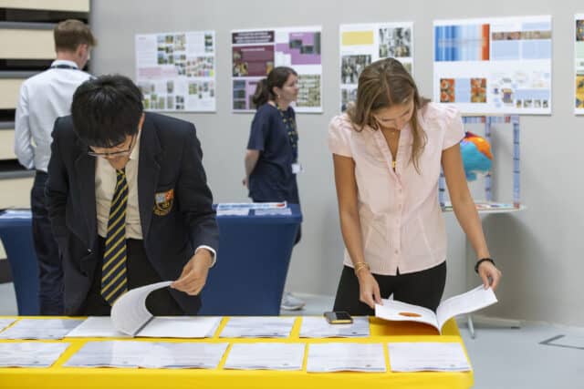 Cranleigh students examining work at the EPQ exhibition